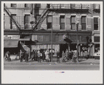 Lower Douglas Street, where unemployed hang out, Omaha, Nebraska.