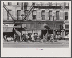 Lower Douglas Street, where unemployed hang out, Omaha, Nebraska.