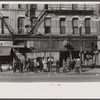 Lower Douglas Street, where unemployed hang out, Omaha, Nebraska.
