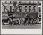 Lower Douglas Street, where unemployed hang out, Omaha, Nebraska.