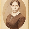 Studio portrait of young woman wearing chain necklace.