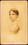 Portrait of unidentified young woman wearing ribbon on head.