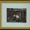 Social conditions - [Tenement conditions - Getting water in front of outhouses.]