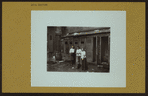 Social conditions - [Tenement conditions - Getting water in front of outhouses.]