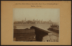 East River - [North (Hudson) River] - Shore and skyline of lower Manhattan - South Ferry - Williamsburg Bridge.