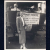 Paula Bauersmith in front of publicity advertising the play Rhyme Without Reason
