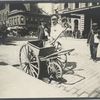 Street sweeper with hand cart.