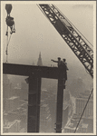 Two construction workers at the corner of two steel beams pointing to the left