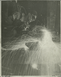 Worker torch-cutting steel
