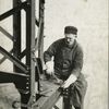 Worker attaching a bolt onto a beam