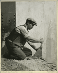 Worker bolting a steel support