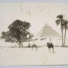 Two men riding camels in front of a pyramid