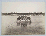 Men in uniform on a raft