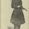 Man in overcoat and top hat with cane, England