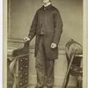 Man in coat standing, London, England, 1860s