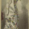 Woman in floral dress holding a fan, England, 1880s