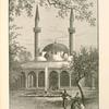 Mosque of the Tekîyeh, or Hospice of the Sultan Selim.  Its position is shown in the illustration on page 381. The court is planted with walnut-trees. The cloisters and interior of the mosque are decorated with exceedingly fine glazed tiles.