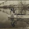 Woman paddling a canoe