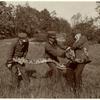 Park employees holding a snake, 1906