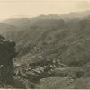 From Kapirkate overlooking the Khargati Ridge. The battle ground of 11th May 1919. Bagh Springs + village in the distance and remains of old Bhuddist Stapa [?] on extreme left. Ghurkha sentry in foreground.