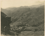 From Kapirkate overlooking the Khargati Ridge. The battle ground of 11th May 1919. Bagh Springs + village in the distance and remains of old Bhuddist Stapa [?] on extreme left. Ghurkha sentry in foreground.