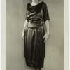 Woman in black dress with tassels, ca. 1921