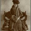 Woman wearing fur cape with fur muff, ca. 1906