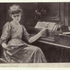 Young woman seated at harpsichord.