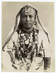 Portrait of a young woman in elaborate robes and jewelry