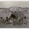 A group of Bisharin before their tent at Wady Halfa, Egypt.