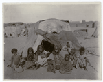 A group of Bisharin before their tent at Wady Halfa, Egypt.