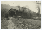 The Covered Bridge on a Country Highway.