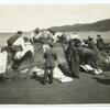 Indians cutting up a whale at Neah Bay, Washington.
