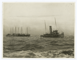 Barges towed at sea.