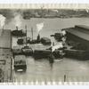 Shifting freight between docks, New York.