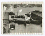 Shifting freight between docks, New York.