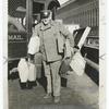 A Mail Carrier delivering parcel post.