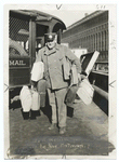 A Mail Carrier delivering parcel post.