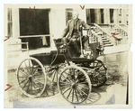 George B. Selden in his first automobile, 1877.