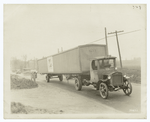 Transporting automobiles by truck.