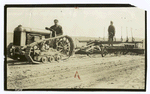Fordson tractor pulling a scraper.