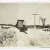Motor-driven plow for clearing roads of deep snow.