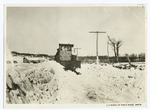Motor-driven plow for clearing roads of deep snow.