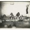 Indian women grinding corn.