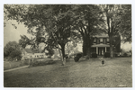 Two negative print of large homes with big trees