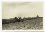 Man on horse drawn tractor