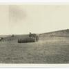 Field with bale of hay