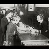Fordham, children checking out books after book talk