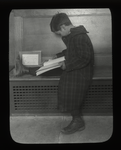 Fordham, boy reading on bench