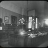 George Bruce Interior Views: Miss Griffith at desk, Circulation room